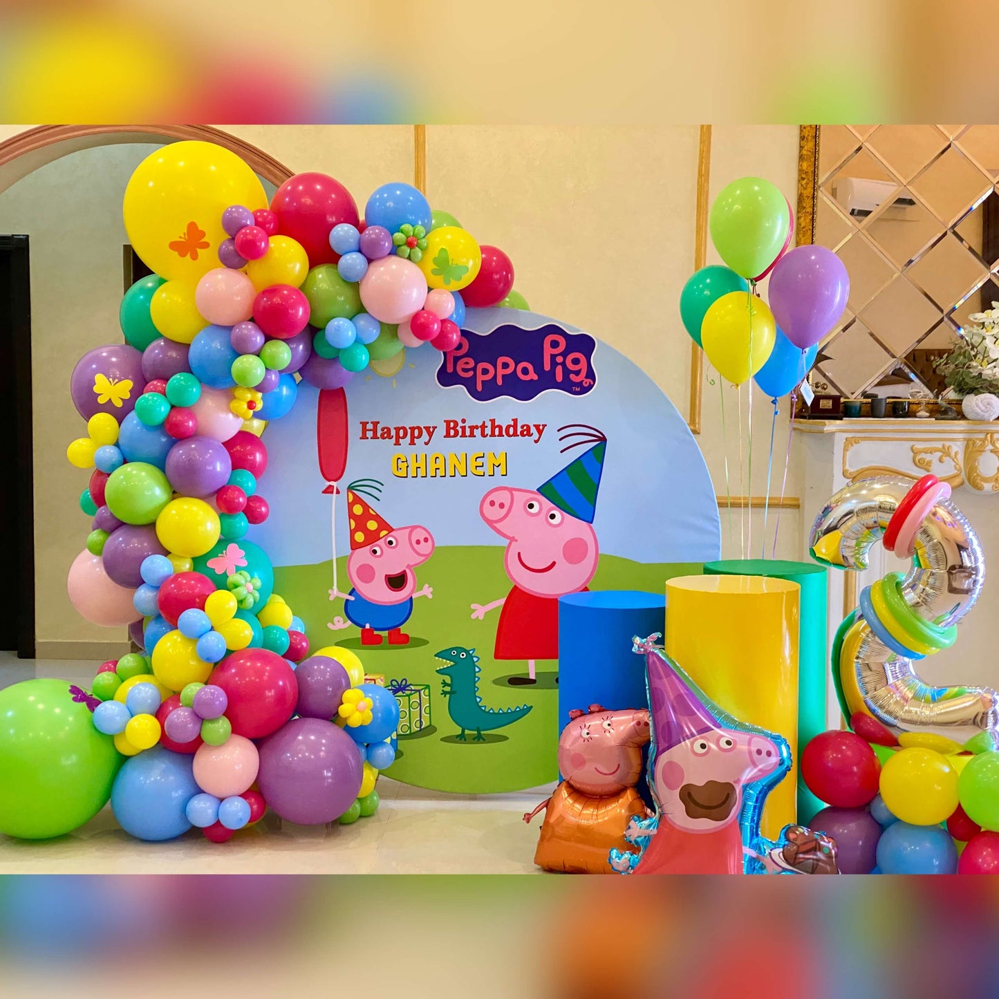 Peppa Pig birthday balloon setup with colorful decorations for kids party in Dubai.
