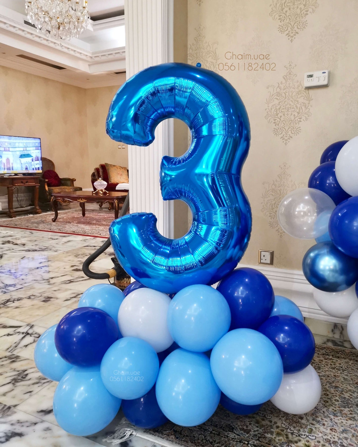 Blue number balloon decoration with luxury blue and white balloons for kids party in Dubai.