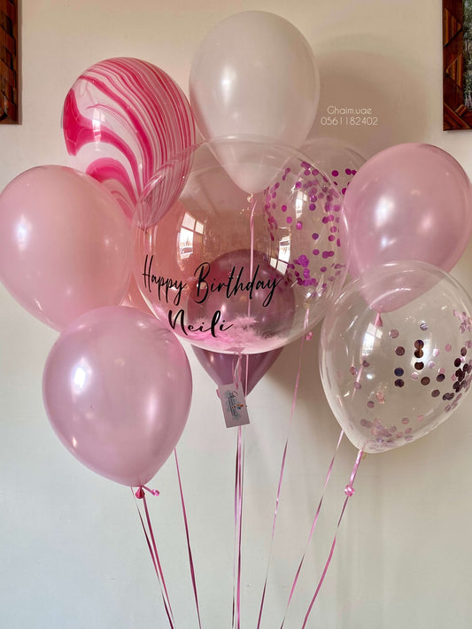 Pink and white helium balloon bouquet with confetti balloons and custom text bubble balloon