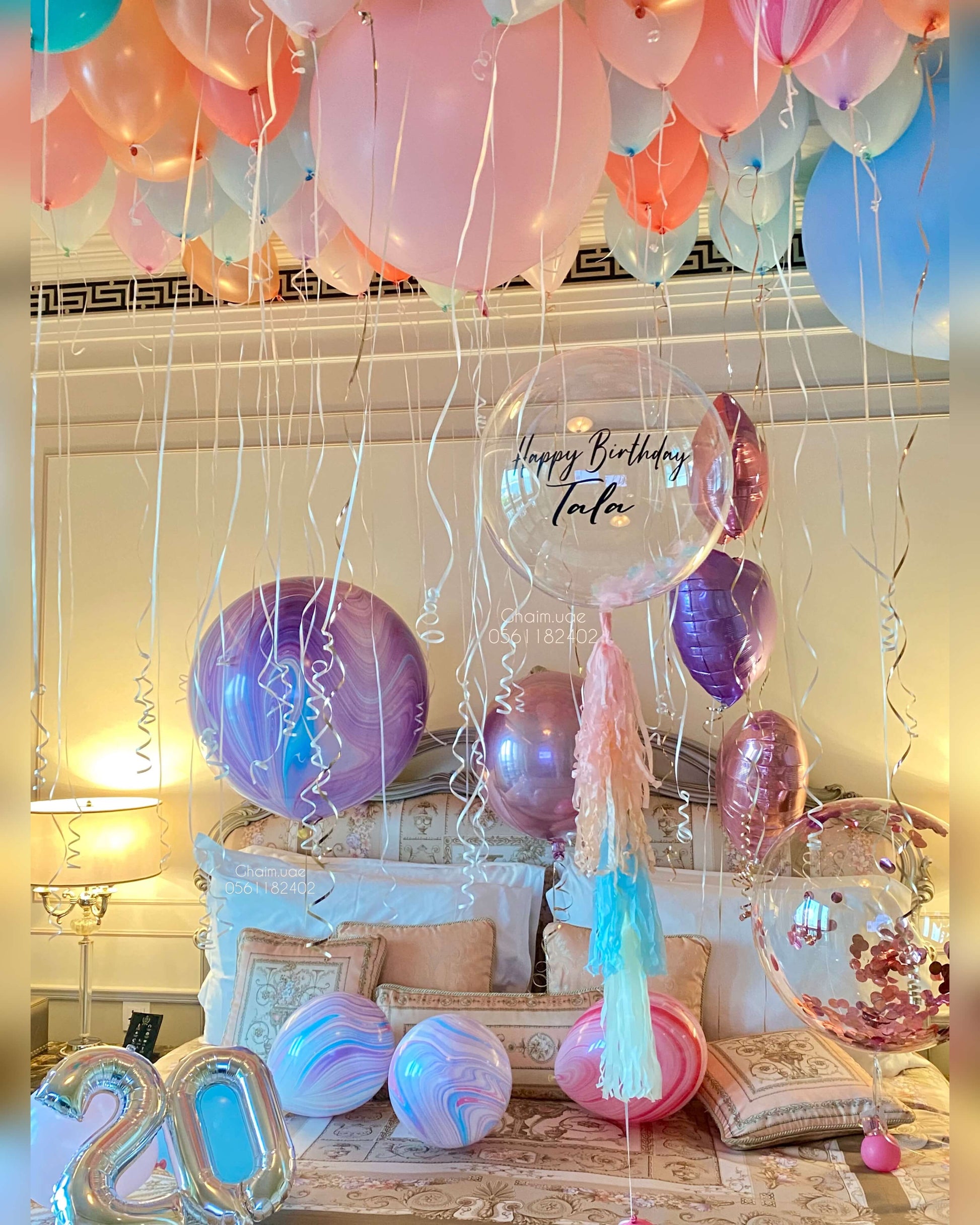 Pastel helium balloon room setup with ceiling balloons, number balloons, and custom text bubble balloon