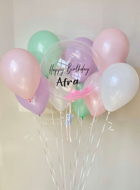 Pastel helium balloon bouquet with custom text bubble balloon