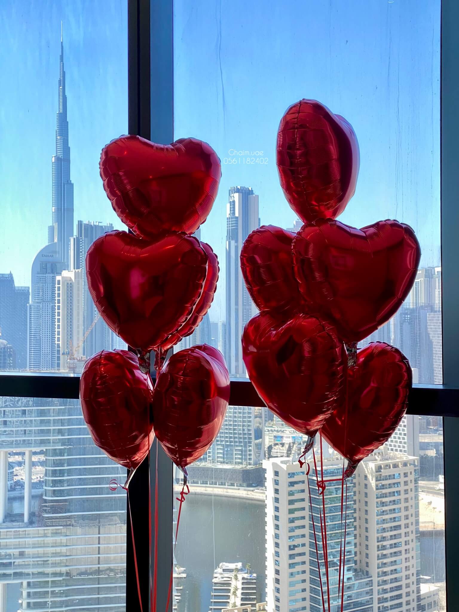 Red heart foil balloons luxury romantic setup Dubai UAE