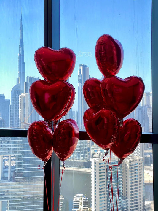 Red heart foil balloons luxury romantic setup Dubai UAE