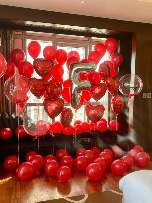 Luxury red balloon room decor romantic surprise Dubai UAE